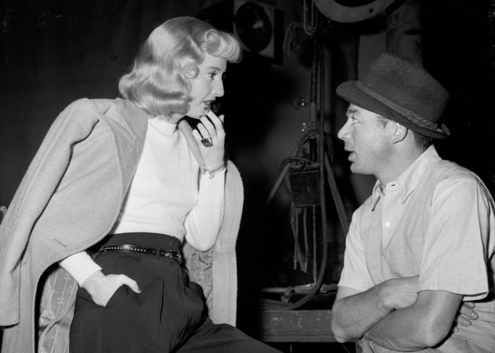 Barbara Stanwyck with Billy Wilder on the set of 'Double Indemnity'.