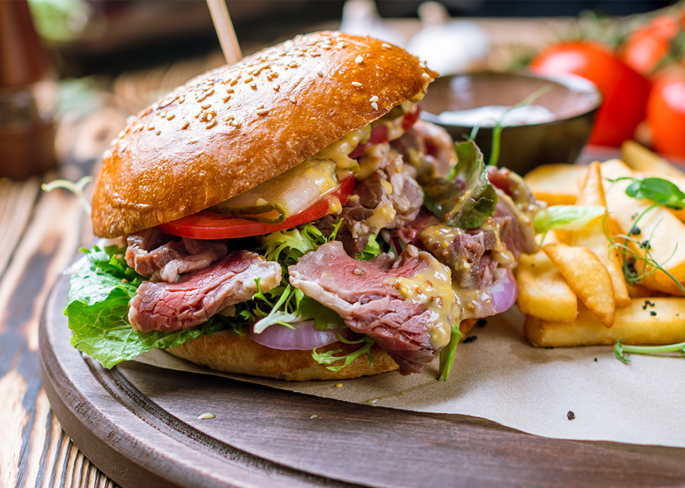 Burger with pastrami and fries.