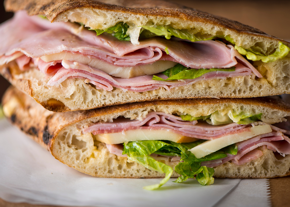 Country ham and Swiss cheese with lettuce on flatbread.