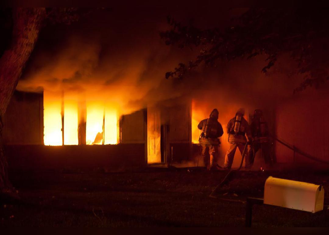 Firefighters fighting a house fire. 