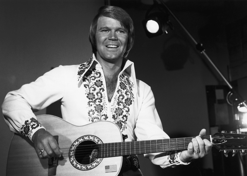 Glen Campbell playing guitar.