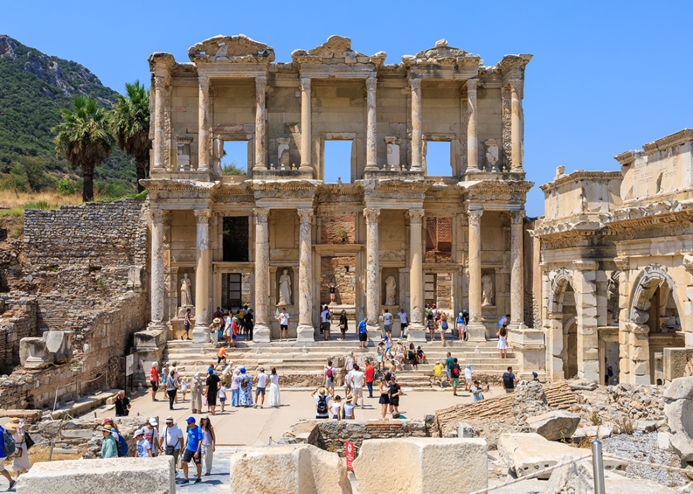 Tourists exploring the Library of Celsus in Ephesus.