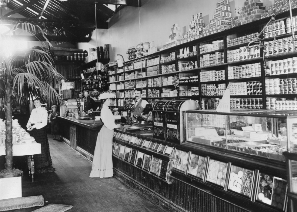 Woman standing by cashier in a general store