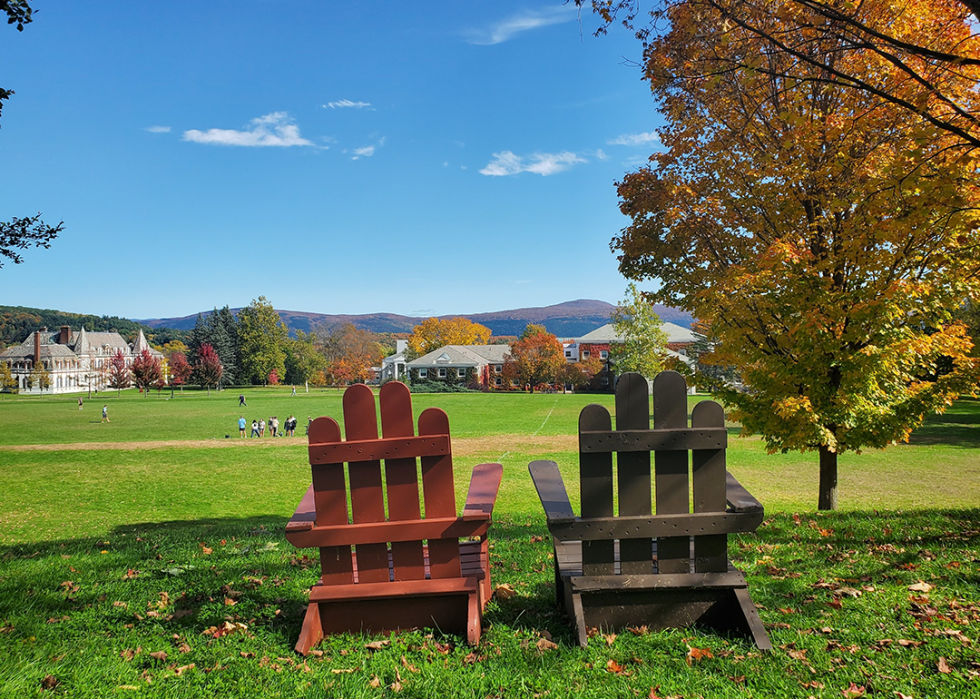 Adirondack chairs overlooking scene of Vermont foliage at Middlebury College.