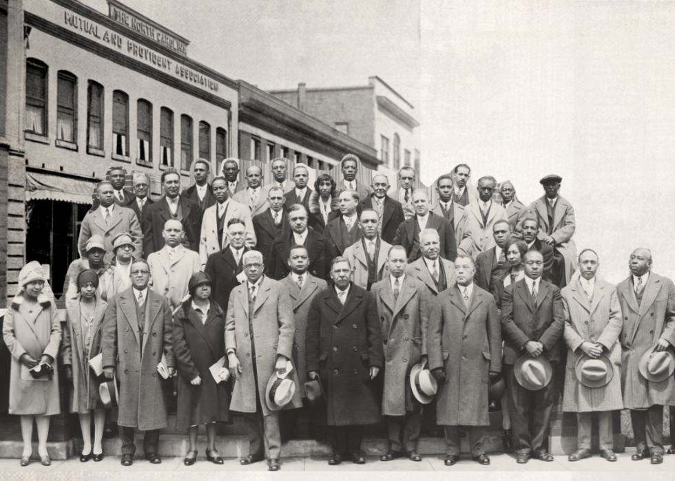 Group portrait of the National Negro Insurance Association and The North Carolina Mutual Block on Parrish Street in Durham.