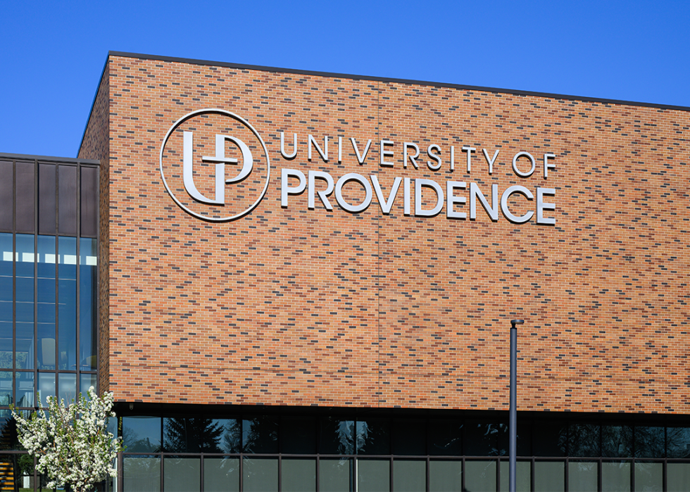 Sign on brick wall at University of Providence.