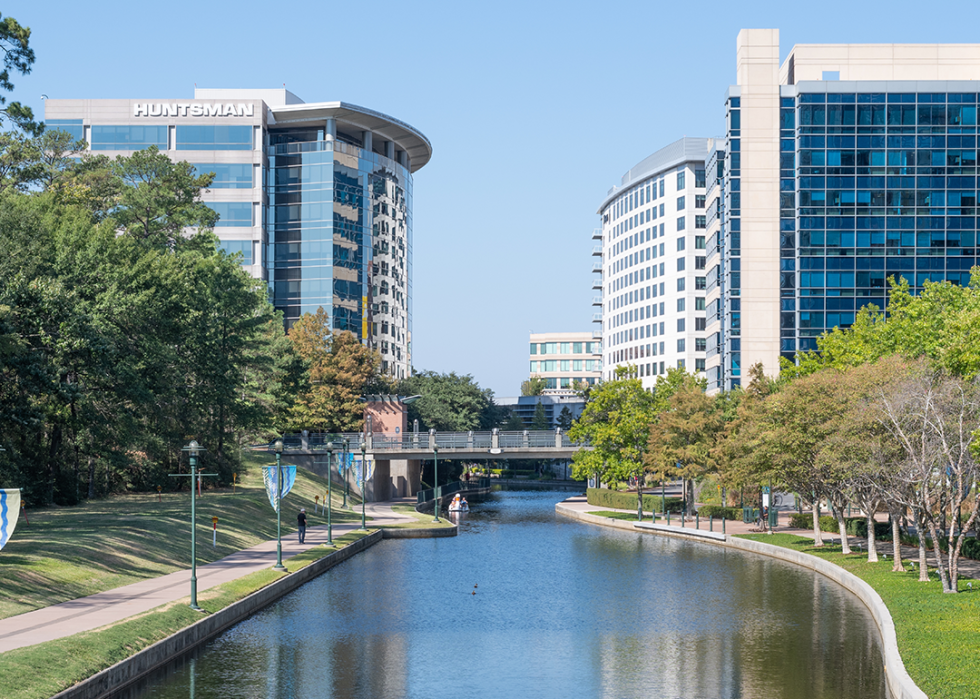 A river winding its way through the business district of an urban community.