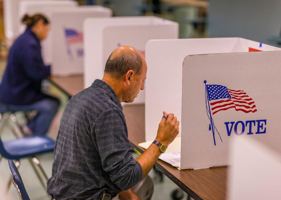 Male voter fills out ballot