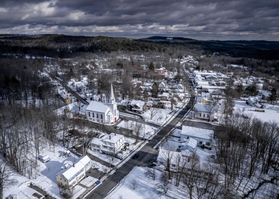 Aerial view of Ashburnham in winter with the town covered in snow.