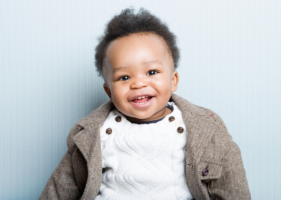 African American baby boy wearing a jacket.