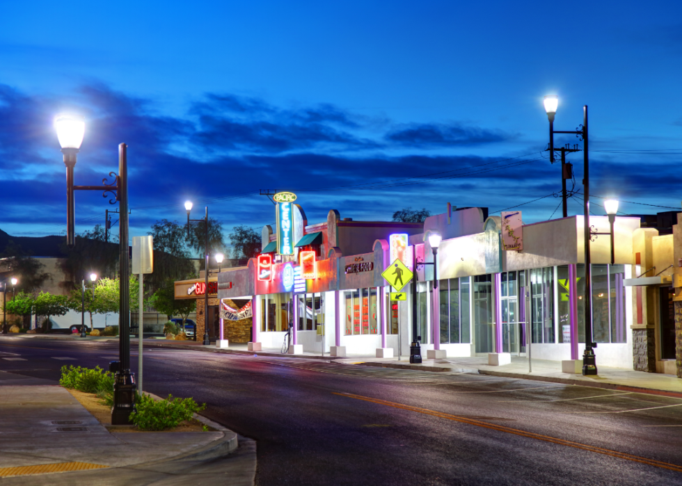 Neon signs on a small street in Henderson, NV at night.