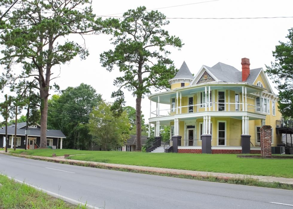 A historic home with a pine tree in the yard in Opelousas, Louisiana.