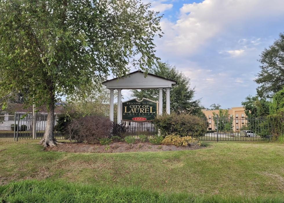 A sign reads "Welcome to the City of Laurel, Mississippi."