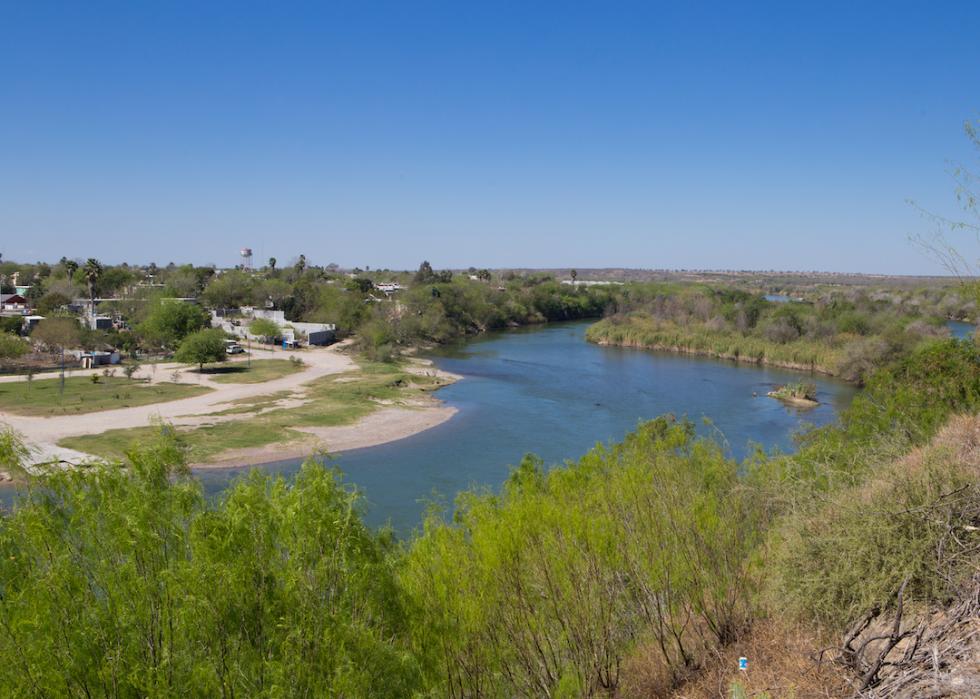 Winding Rio Grande River separating the U.S. and Mexico. The right side is Roma, Texas, and the left side is Mexico.