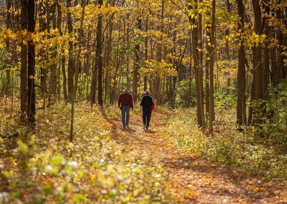 A couple walks along a path at Sugarcreek Metro Park in Bellbrook, Ohio.