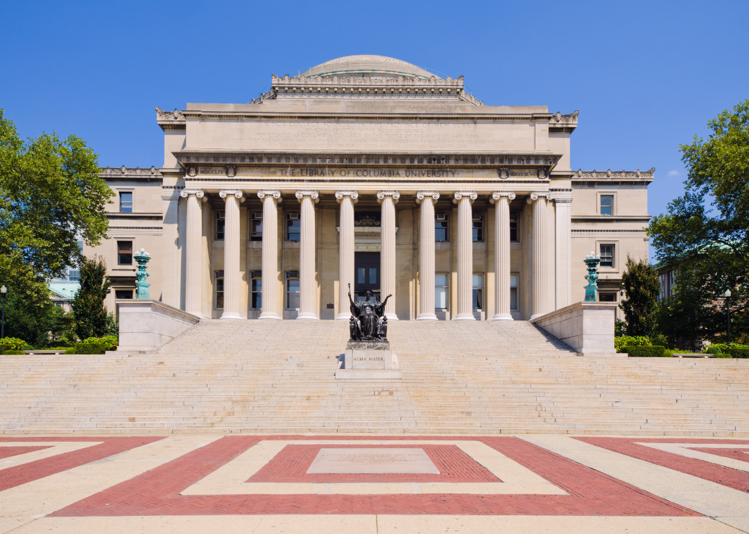 A historic stone library with columns in front at Columbia University.