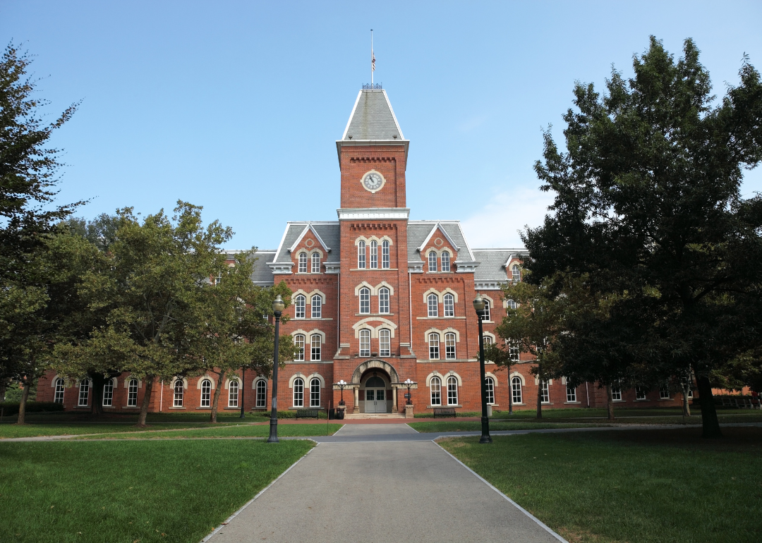 A large brick building with a clocktower on top at Ohio State University.