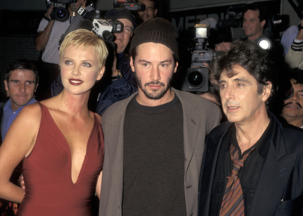 Charlize Theron, Keanu Reeves, and Al Pacino attend the New York premiere of "Devil's Advocate."