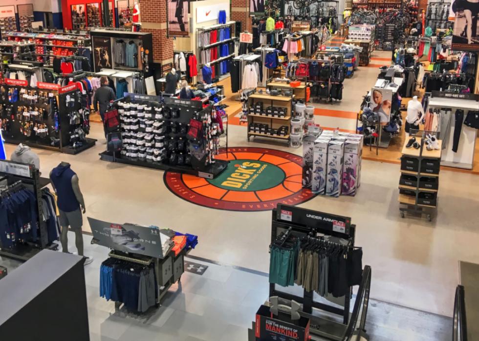 A couple of shoppers inside a Dick's Sporting Goods store.