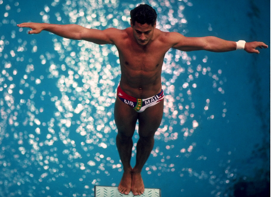 Greg Louganis stands at the edge of the diving board before attempting a dive during the 1988 Summer Olympic Games
