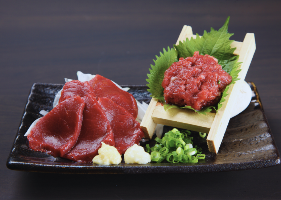 Horse meat sashimi and horse meat tartare on a plate.