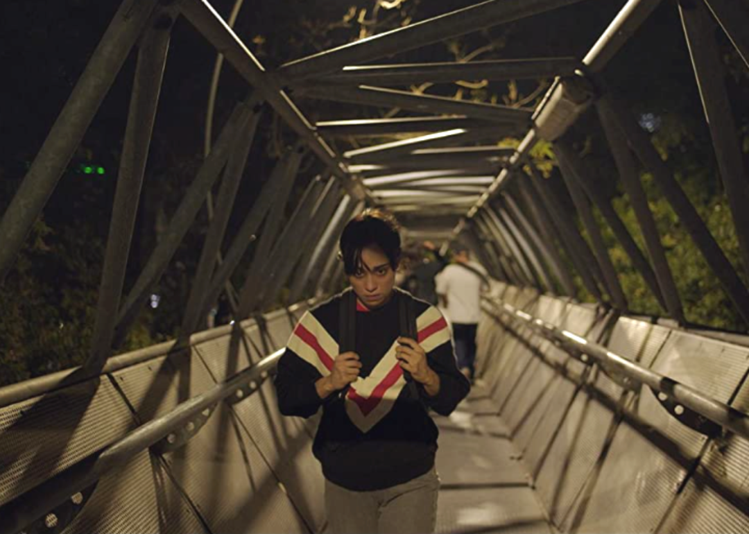 Natalia Solian walking at night in a scene from Huesera: The Bone Woman.