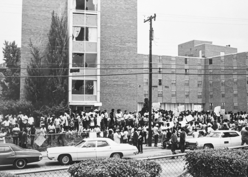 People gather outside women's dormitory Alexander Hall at Jackson State College in Mississippi.
