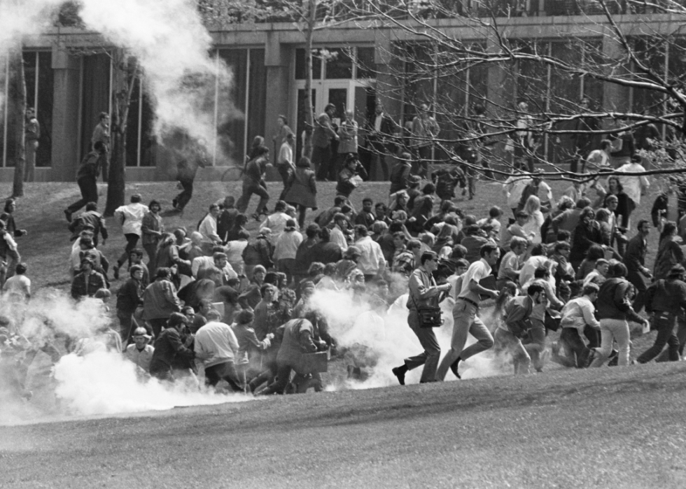 Demonstrators flee tear gas at Kent State.