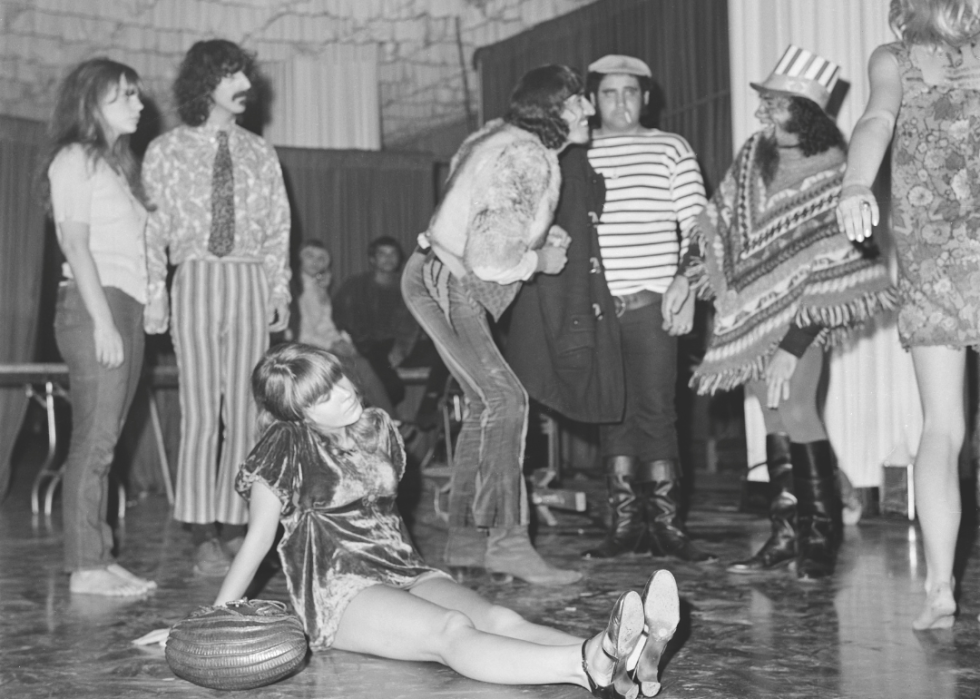 Revelers in '60s outifts mingle on the floor of the Whiskey.