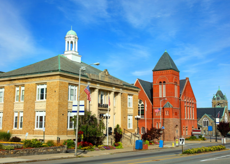 A few brick buildings along a city street. 