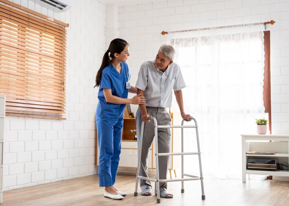 Senior patient doing physical therapy with physical therapist aide.