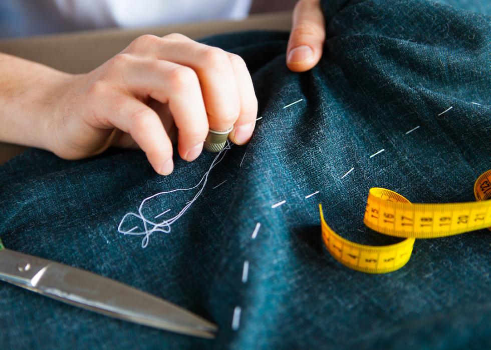 Hand sewing garment.