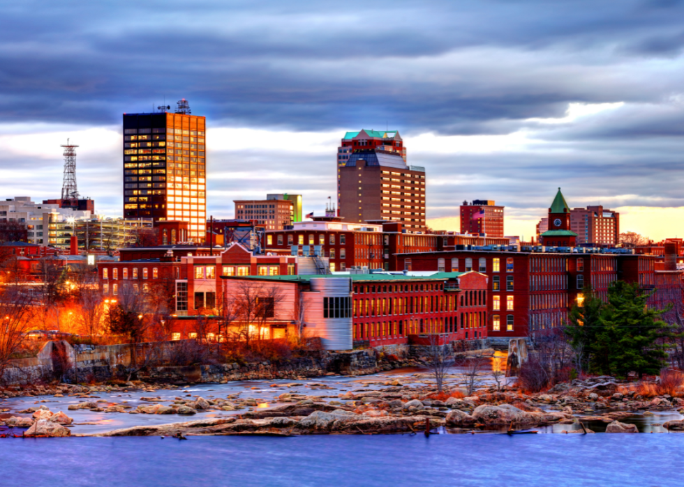 View of city buildings by the body of water. 