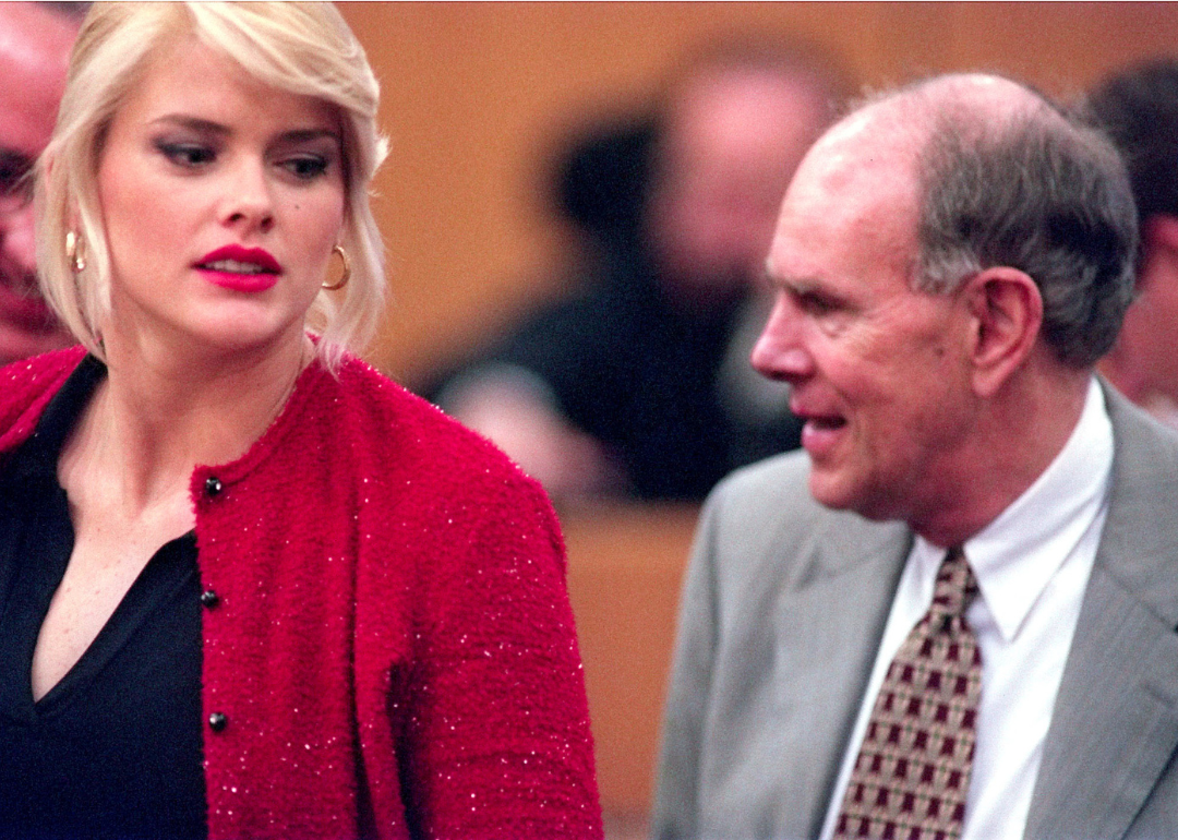 Anna Nicole Smith looks at stepson J. Howard Marshall II outside trial