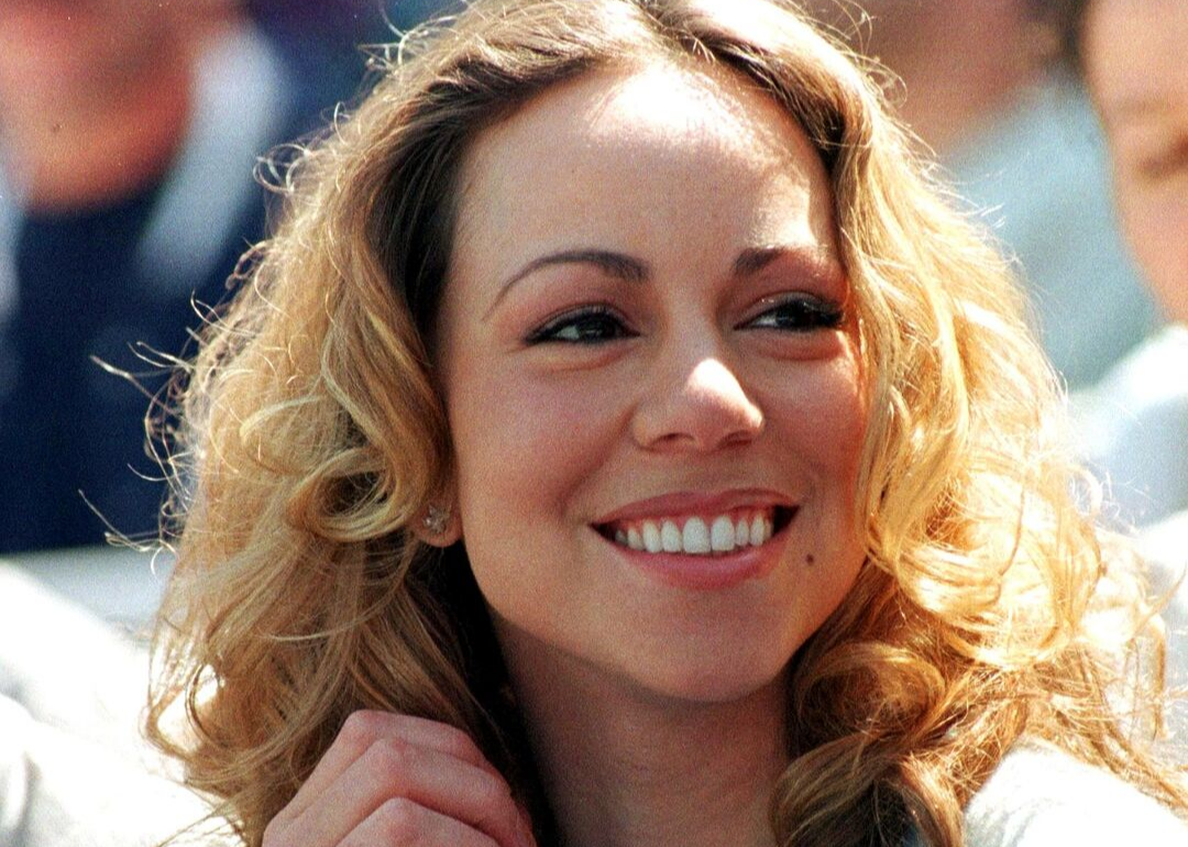 Mariah Carey smiles for portrait.