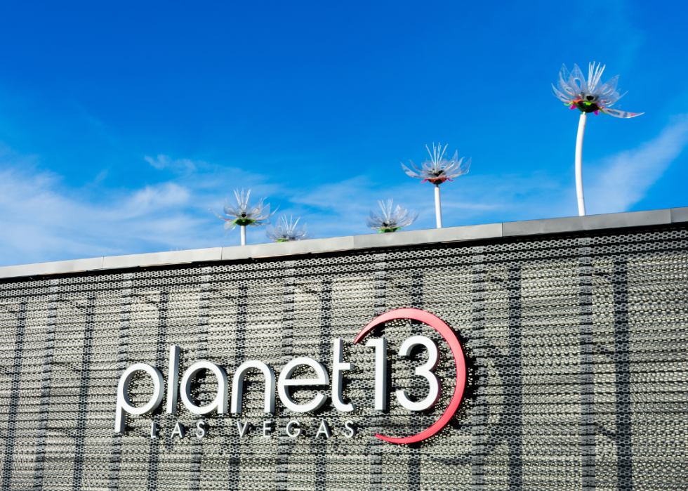 Planet 13 Las Vegas sign on the exterior of a large cannabis dispensary.