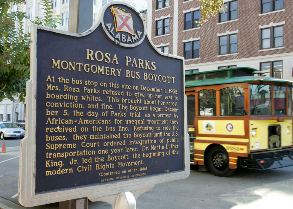  A trolley passes the site where civil rights icon Rosa Parks was arrested, marked with a plaque.