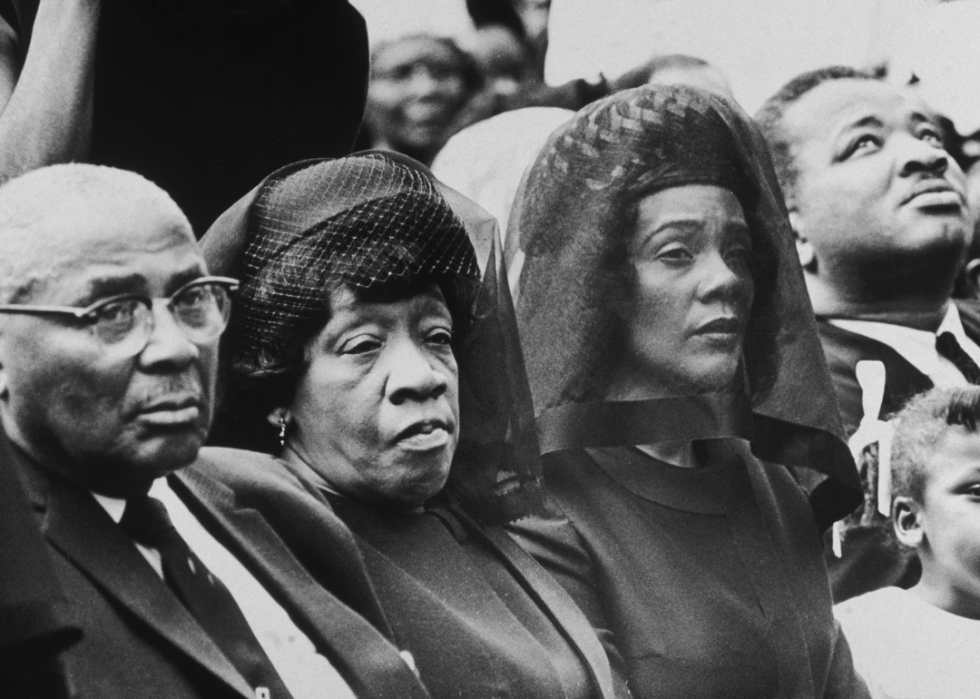 The parents and the widow of Martin Luther King Jr. listen to ceremonies at Morehouse College during a memorial after his death.