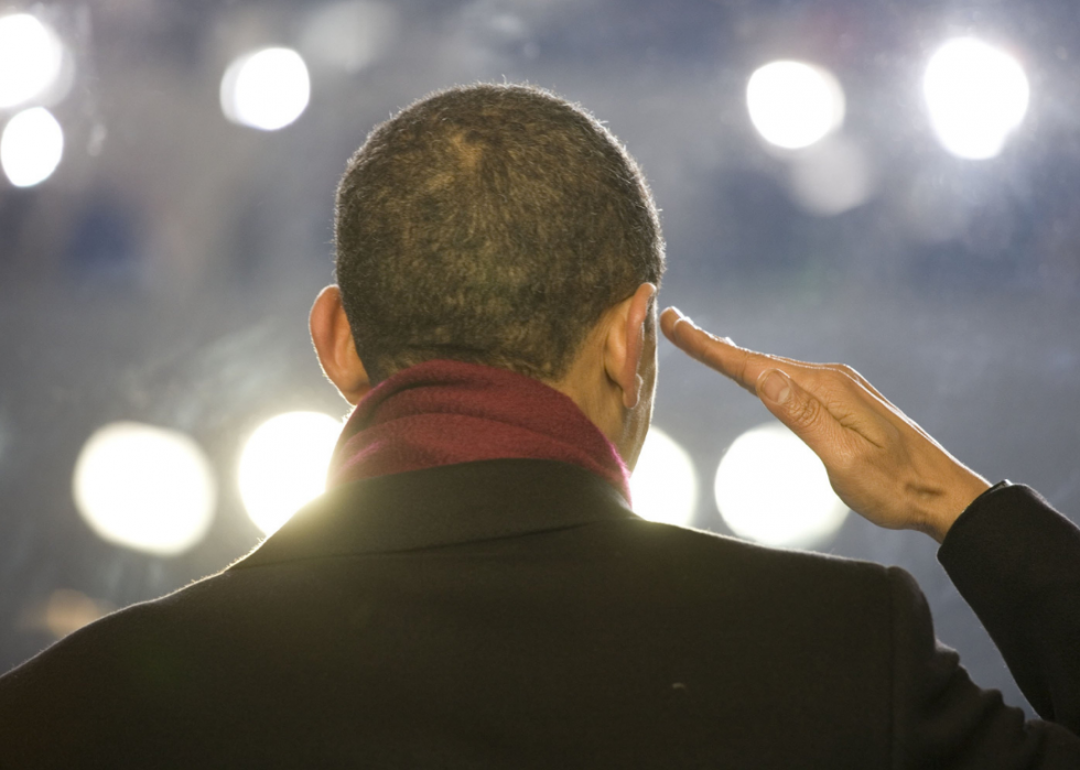 Obama salutes a passing American Flag during the inaugural parade.