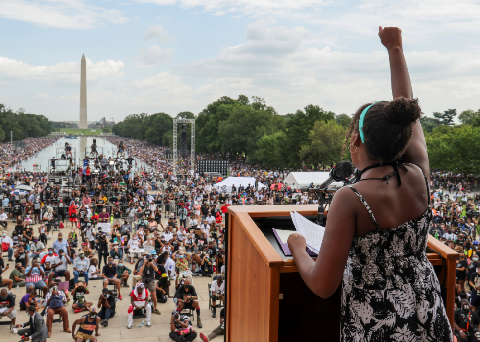Yolanda Renee King thrusts her fist as she speaks to the Get Your Knee Off Our Necks Commitment March on Washington 2020 from where her grandfather delivered his 'I Have a Dream' speech.