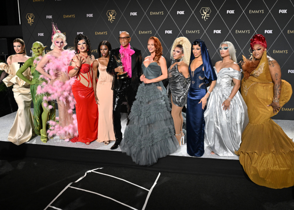 RuPaul poses in the press room with drag performers during the 75th Emmy Awards. 