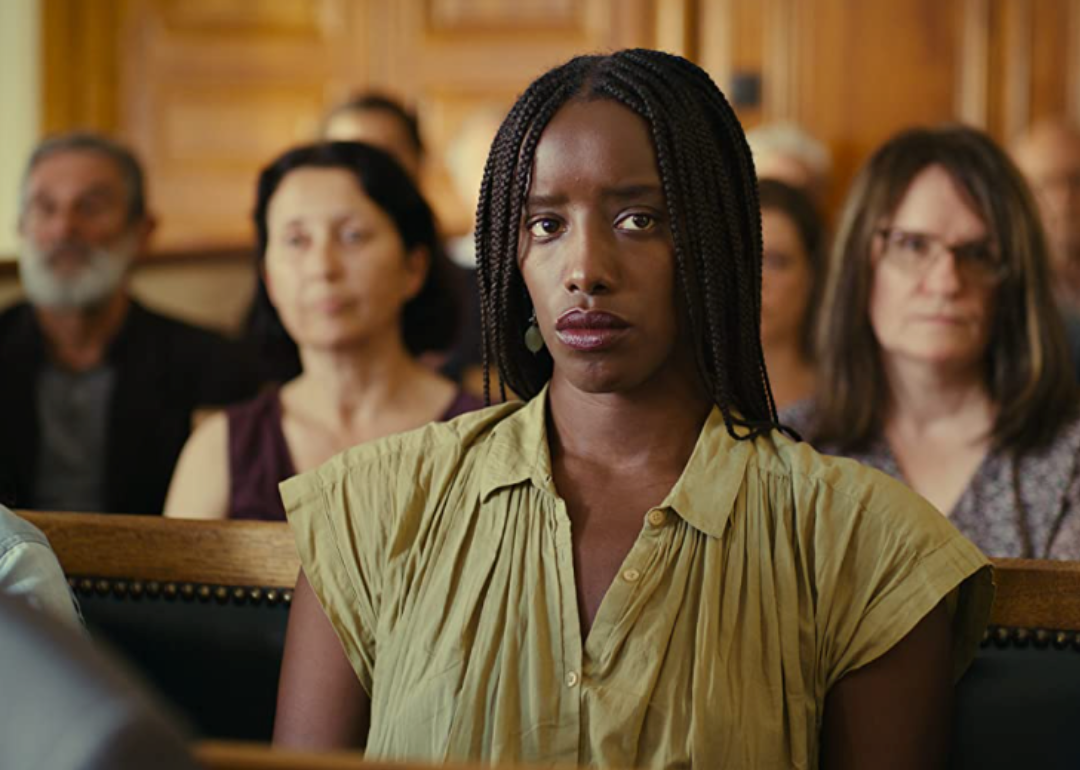 Kayije Kagame sitting in a courtroom in Saint Omer. 