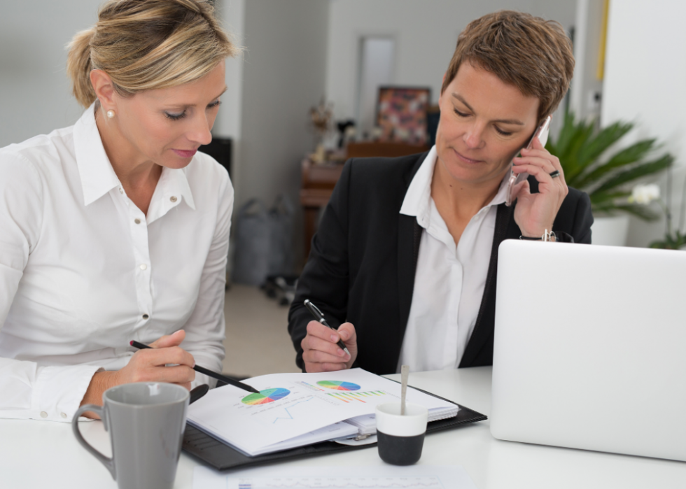 Two women looking at charts.