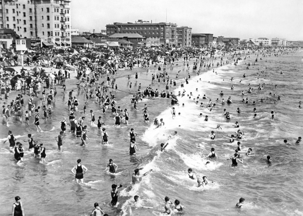 Crowds of Sunday bathers enjoying the warm waters at Ocean Park Beach in Santa Monica