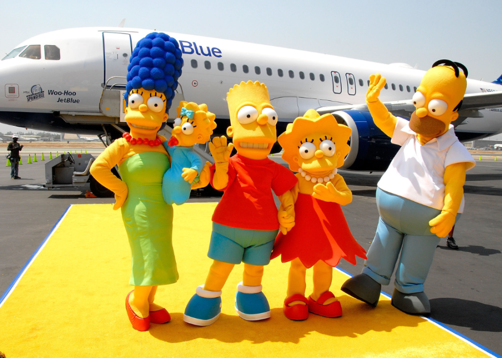 BURBANK, CA - JULY 17: The Simpsons family members Marge, Maggie, Bart, Lisa and Homer Simpson attending the JetBlue Airways Unveiling of "Simpsons" aircraft to celebrate upcoming release of "Simpsons" movie held at Million Air Burbank on July 17, 2007 in Burbank, California.