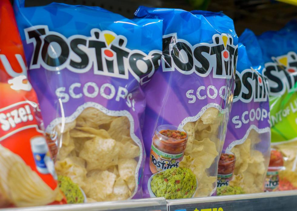 Tostitos Scoops on a store shelf inside a grocery store.