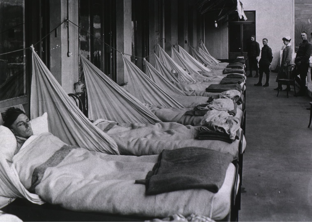 Patients suffering from Spanish flu lie in a ward full of beds