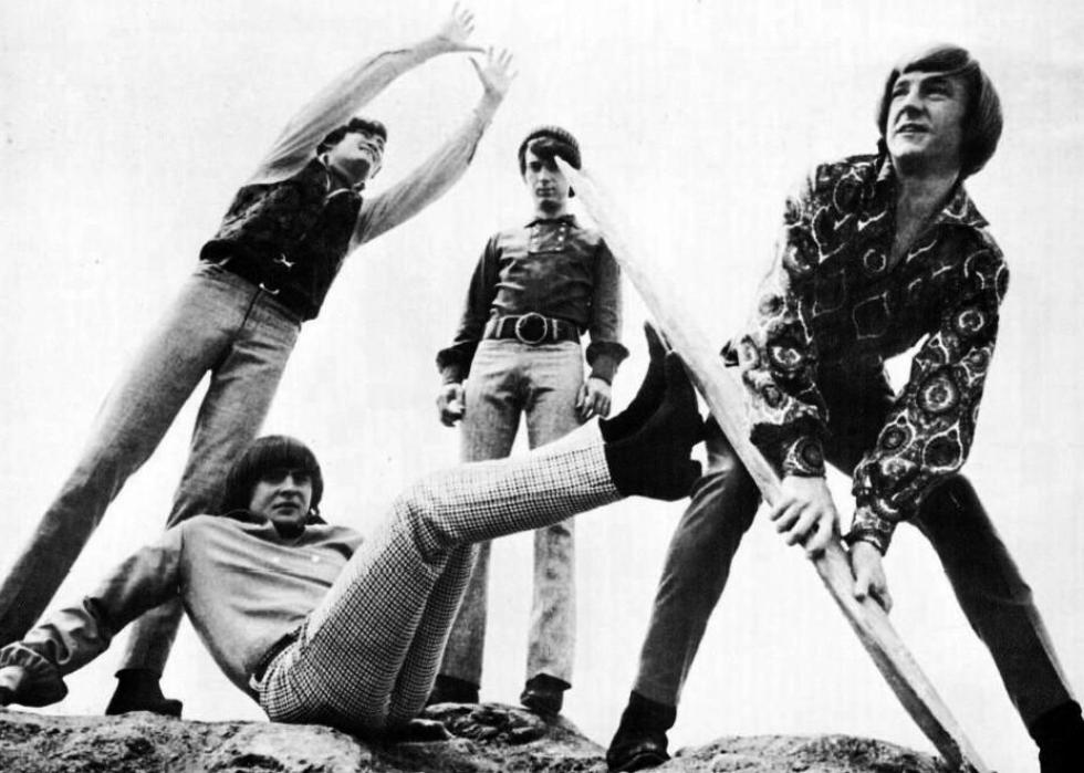 The Monkees frolic on the beach for a photo shoot