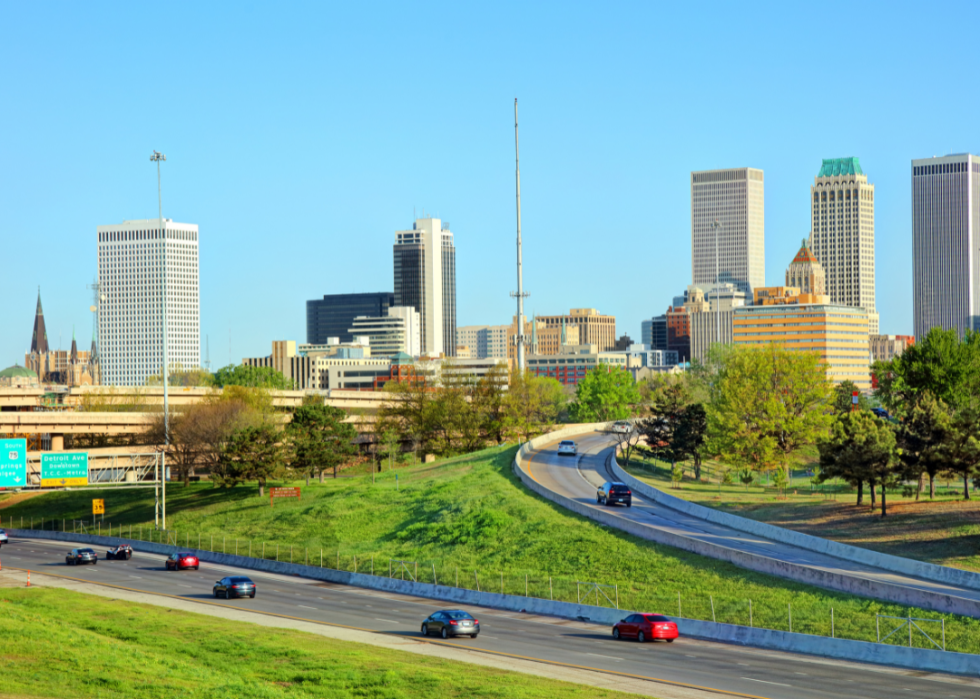 A city skyline with roads around it. 