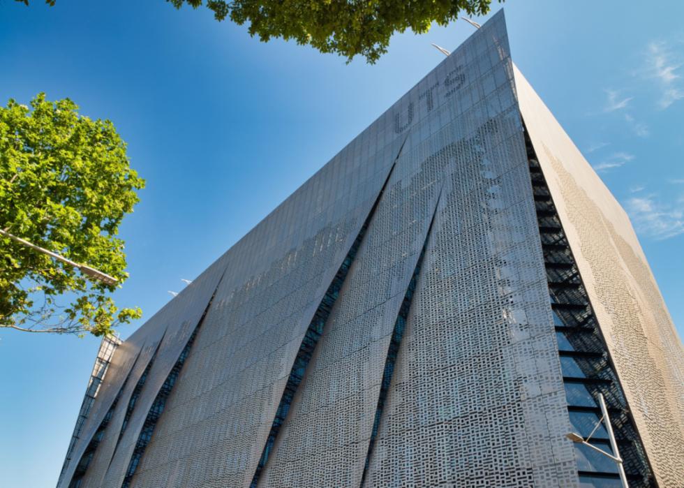 An upward view of an abstract silver building at University of Technology Sydney.